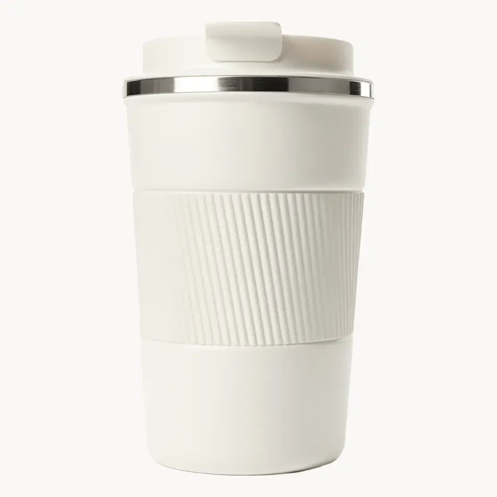 White travel coffee mug with ribbed grip and lid, ideal for on-the-go use
