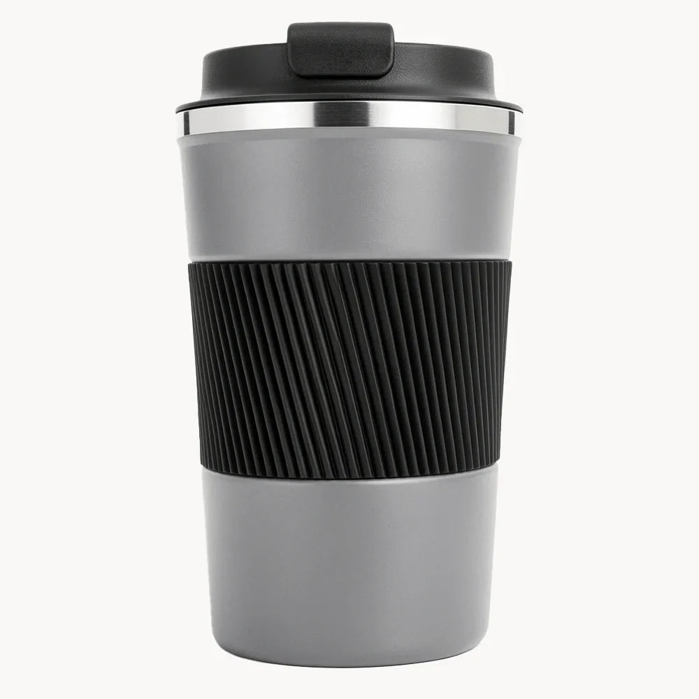 Gray travel coffee mug with black grip and lid, portable design for on-the-go use