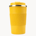 Bright yellow travel coffee cup with ribbed grip and lid