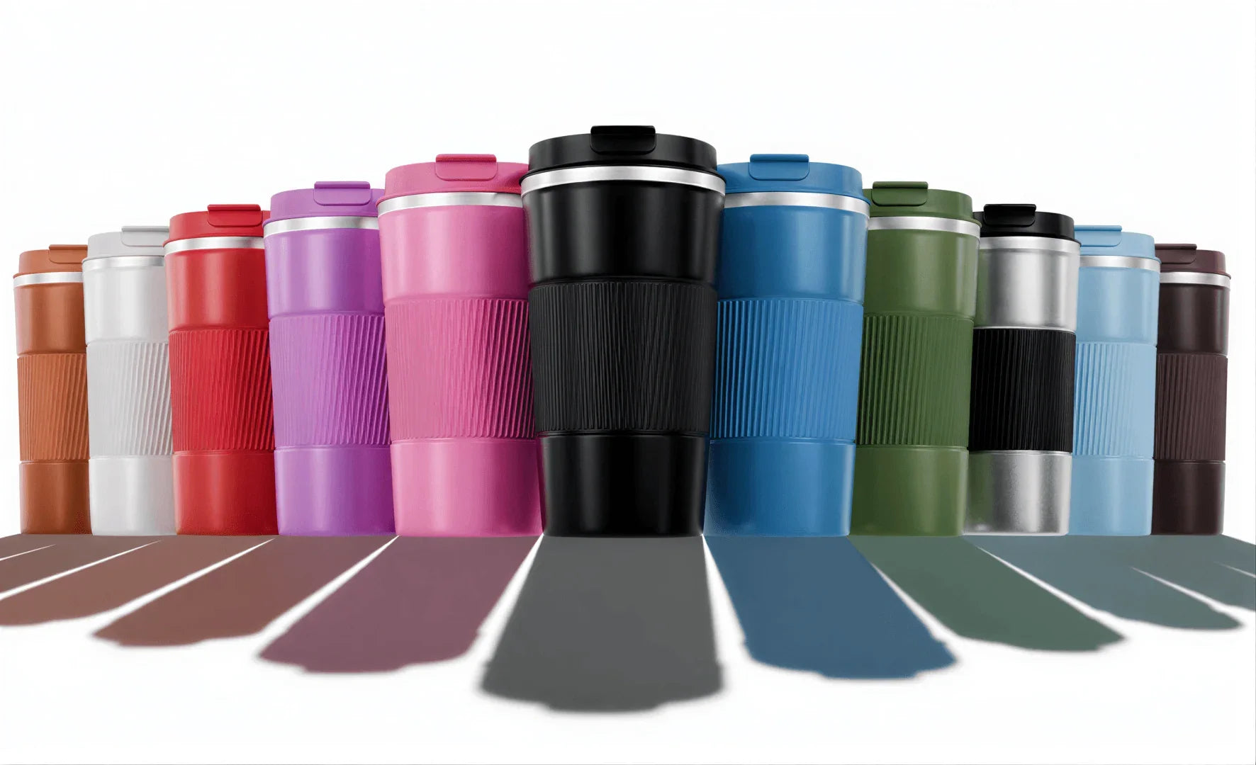 Colorful travel mugs with lids, ribbed design, and stainless steel accents for on-the-go coffee